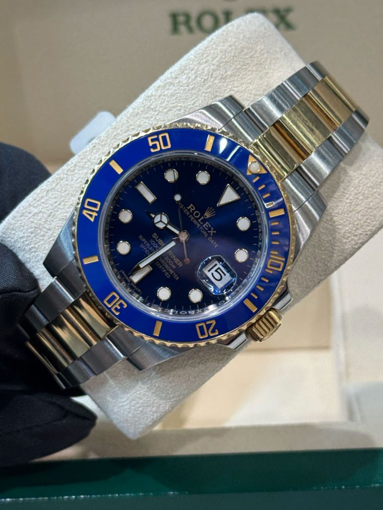 An older watch being examined during restoration at Alpha Group